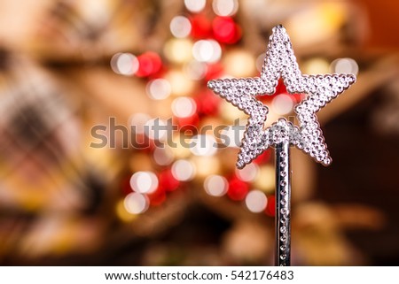 Christmas magic wand in the form of stars. xmas background. light