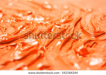 Oil paint a macro picture. Orange abstract background.