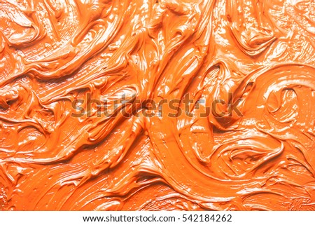 Oil paint a macro picture. Orange abstract background.