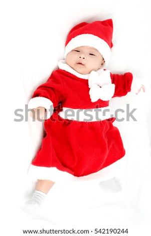 Portrait of adorable baby girl with santa costume. Isolated on white background 