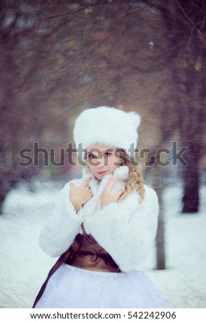 Girl, Blonde in a white fur coat and large hat . Winter photo session in retro style stylized picture