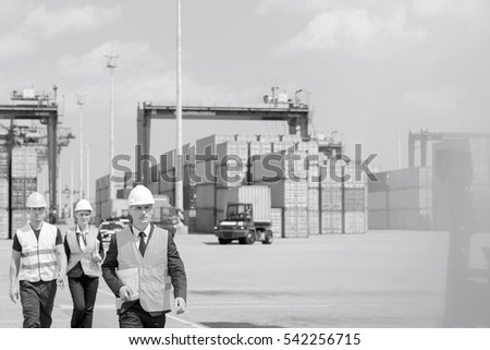 Engineers walking in shipping yard