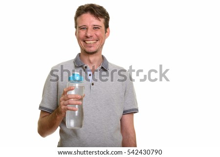 Happy Caucasian man smiling and holding water bottle isolated against white background