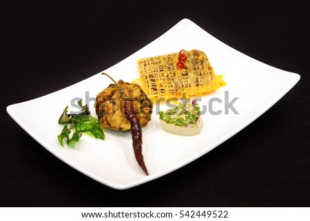A beautiful dinner plate.
A pretty plate of food Thailand.
Black Background.
