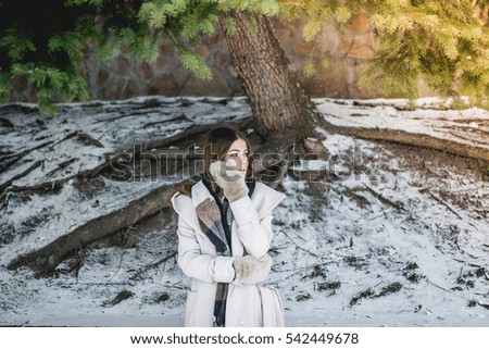 Woman outdoors in winter wearing gloves