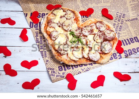 Pizza heart shaped . Baked heart-shaped homemade pizza