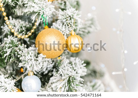 Christmas tree background, bright gold ornaments new year, white fireplace