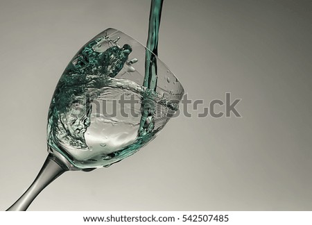 blue water splash on a glas