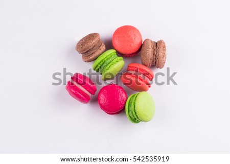 Macaroons for dessert on a white background.