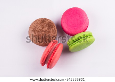 Macaroons for dessert on a white background.