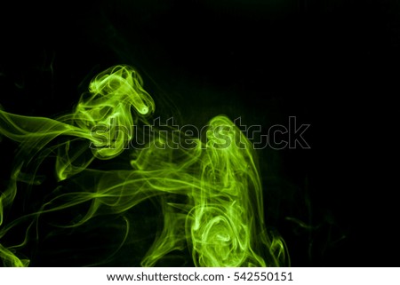 Green smoke on a black background.