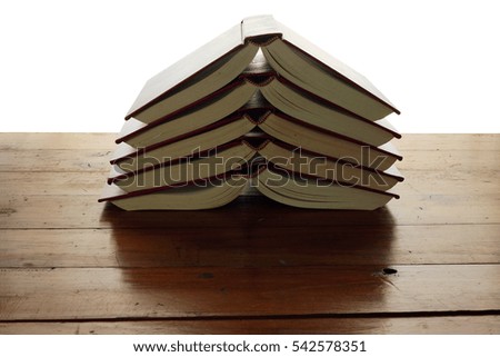 Stack of Books on wooden Background