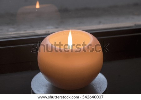 
white candle ball with flame