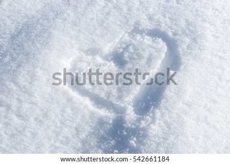 Heart painted on the fresh white snow