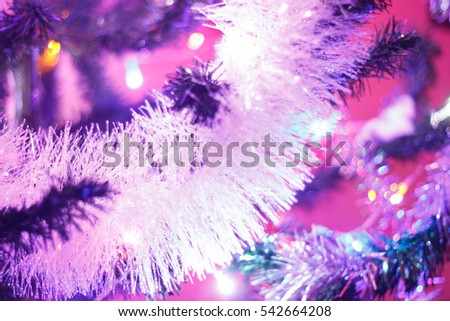 Nice xmas tree lights in tree,Christmas tree background and Christmas decorations with snow, blurred, sparking, glowing. Happy New Year and Xmas theme.