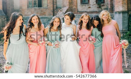 Beautiful bride with her pretty bridesmaids  Royalty-Free Stock Photo #542677366