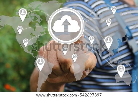 Farmer businessman   presses the button web sign upload cloud connection icon on the touch screen in the web network. Tanned hands, male hands of an elderly person .  