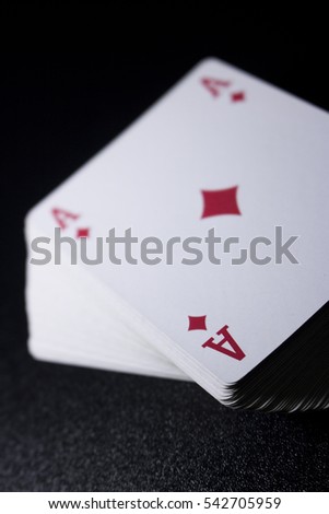 poker card stack deck on dark black background