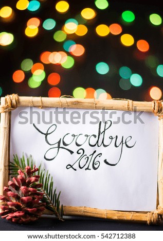 handwirtten goodbye 2016 with star colorful bokeh