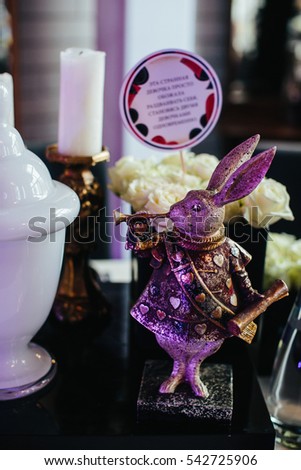 Figure of a rabbit from Alice in Wonderland as a part of dinner table decoration