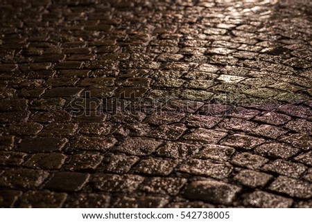 cobble stone street at rainy night