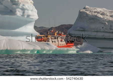 Tourists take pictures of the iceberg. Source of icebergs is by the Jakobshavn glacier. This is a consequence of the phenomenon of global warming and catastrophic thawing of ice, Disko Bay, Greenland