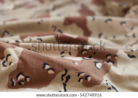 Camouflage texture with white and brown details. War and military texture