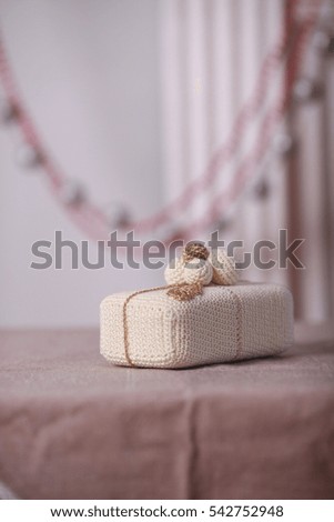 Christmas card. Christmas knitted toy on table, Christmas decoration.