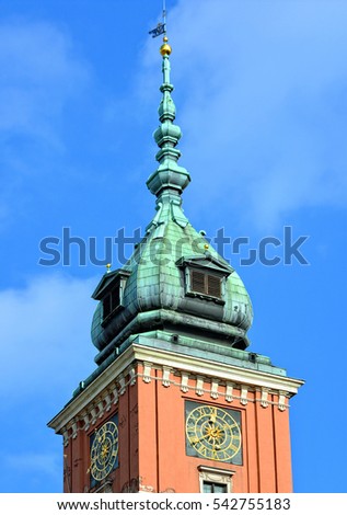 Travel to Europe. Cultural landmarks of Eastern European cities. Beautiful top of an ancient tower with big watches with blue sky in background. Street photography. Vintage artwork 