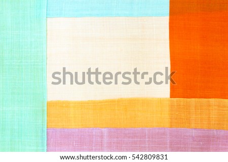 Traditional patchwork background of ramie fabric.
 Royalty-Free Stock Photo #542809831
