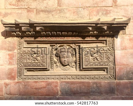 Khatmandu, Nepal-Dec 16, 2016:Ancient woods and stone carving with Hindus symbol in Bhaktapur, Place of devotees. Also known as Bhadgaon or Khwopa, an ancient Newar city in Kathmandu Valley, Nepal