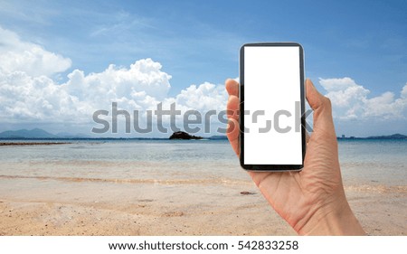 Photographing on the beach with smart phone.