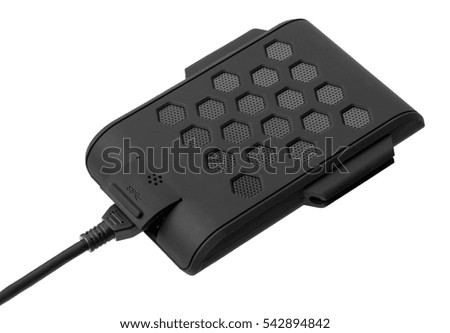 External hard drive of black color with a cable on a white background