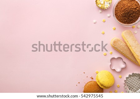 Dessert ingredients and utensils with pink copy space. Top view Royalty-Free Stock Photo #542975545