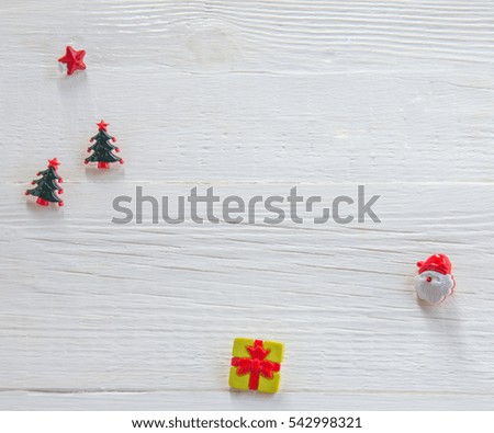 Christmas objects made of plastic on a wooden table