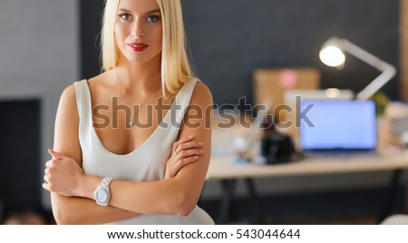 Young fashion designer woman working in studio