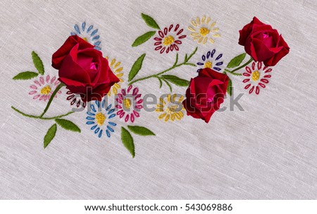  cotton fabric embroidered  to crochet with colorful flowers daisies and roses ,white background, photo from above