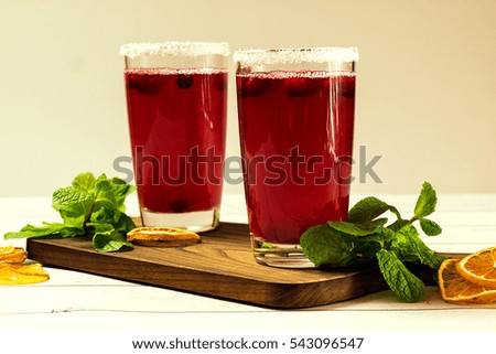 cranberry drink on a wooden background. Selective focus.