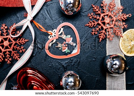 Christmas toys for Christmas tree on a black background, festive composition