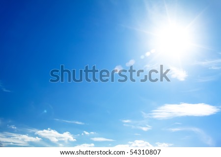 bright blue sky with the sun causing lens flare Royalty-Free Stock Photo #54310807