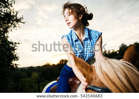 Portrait of beautiful girl with horse 
