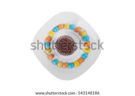 Top view of traditional Brazilian candy brigadier, called in Portuguese brigadeiros isolated over white background.