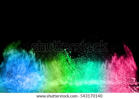 abstract powder splatted background,Freeze motion of color powder exploding/throwing color powder, multicolored glitter texture on black background.