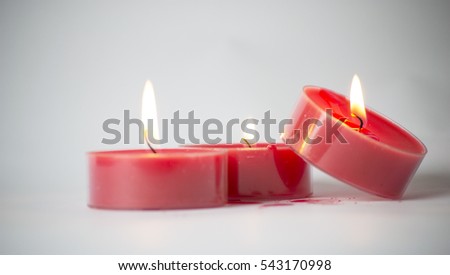 Red candles in a dark background