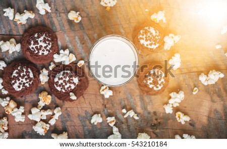 Milk drink with baking, popcorn and sweets
