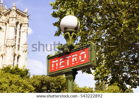 Traditional metro sign in the center of Paris city.