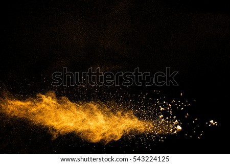 abstract powder splatted background,Freeze motion of orange powder exploding/throwing orange powder