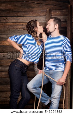 Sailors couple love story on wooden background