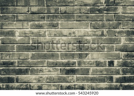 Old brick wall with cracks and scratches. Horizontal wide brickwall background. Distressed wall with broken bricks texture. House facade. Vintage filter.