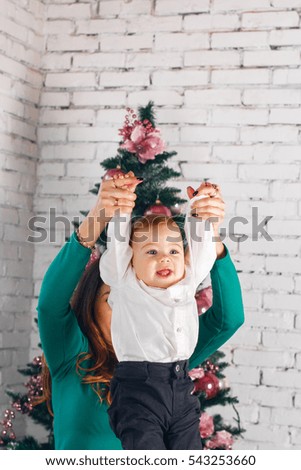 Portrait of happy laughing little boy with his mother